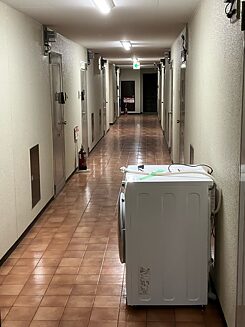 A washing machine in a corridor