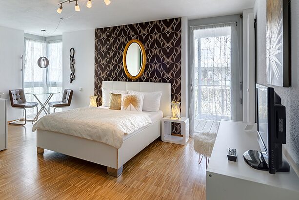A modern furnished room in a Sunnyside Apartment.