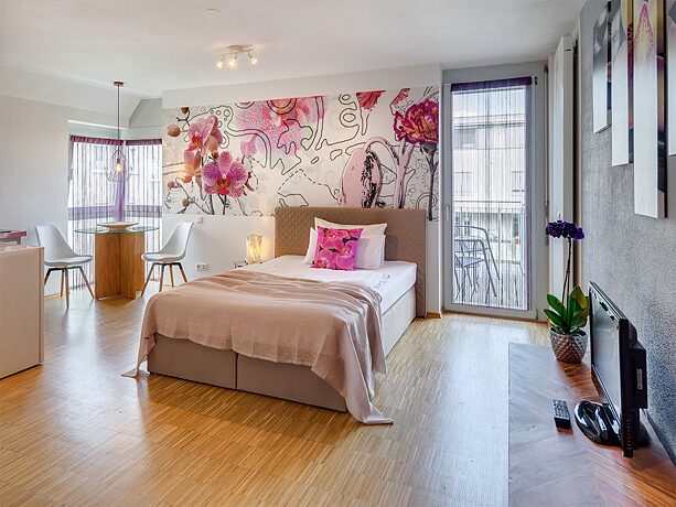 A modern furnished room in a Sunnyside Apartment.