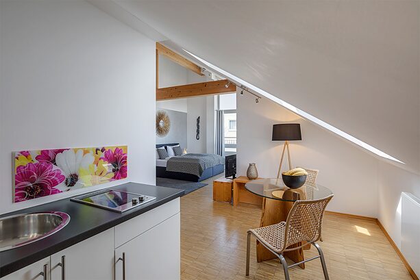A modern furnished room in a Sunnyside Apartment.