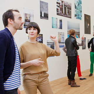 Several people in a gallery.